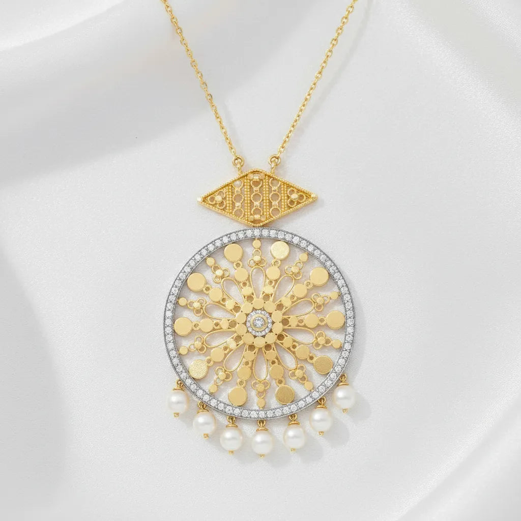 A delicate gold-tone chain paired with a beautifully detailed round pendant. An elegant accessory that adds sophistication and character to any outfit.