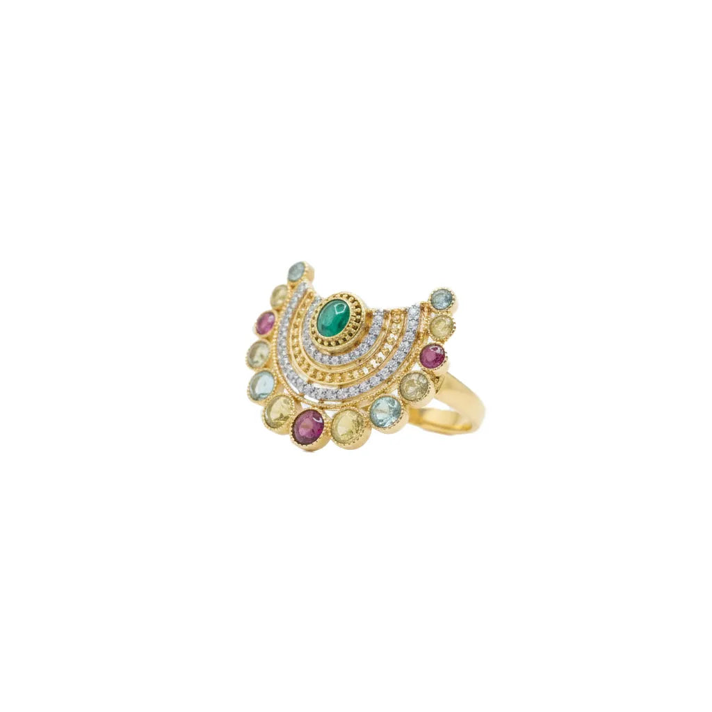 A gold crescent-shaped ring featuring a central green oval stone, surrounded by rows of small clear stones and colorful pink, blue, and yellow-green accent stones, shown on a plain white background.