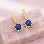 Beautiful drop earrings featuring striking blue stones and a delicate gold-tone finish. A graceful statement accessory for adding color and sophistication to your outfit.