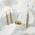 A beautifully coordinated set featuring matching gold-tone jewelry pieces with delicate detailing. A sophisticated choice for creating a complete, polished look.