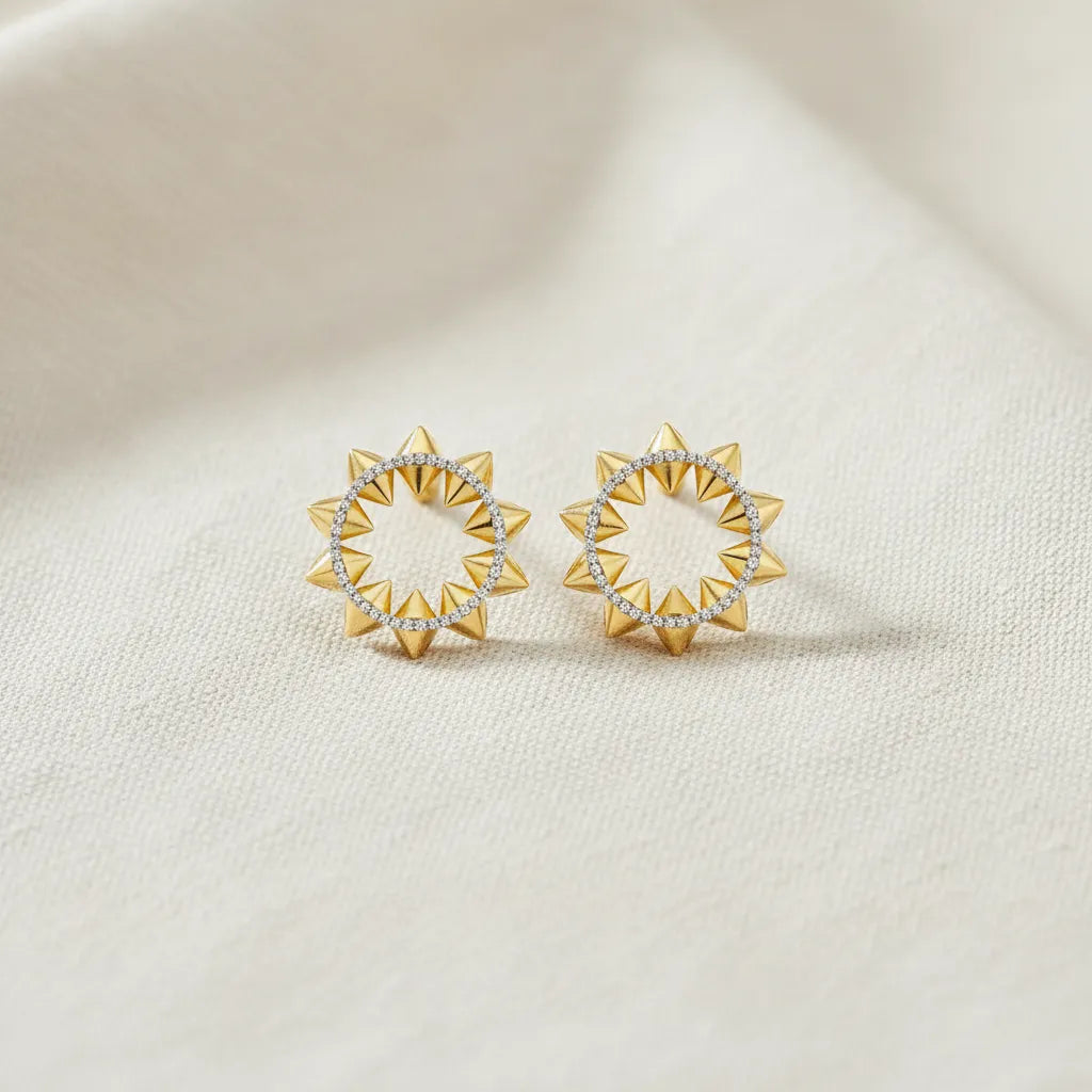 Simple and elegant gold-tone studs earrings designed for effortless everyday styling. Their timeless appearance makes them a versatile addition to any jewelry collection.