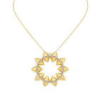 A gold necklace with a circular pendant featuring sharp, pyramid-like spikes and a ring of small clear stones, shown on a plain white background.