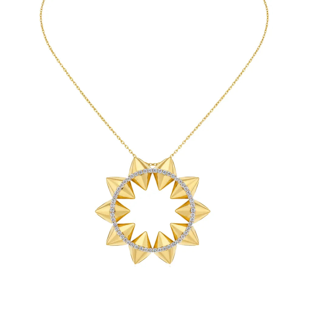 A gold necklace with a circular pendant featuring sharp, pyramid-like spikes and a ring of small clear stones, shown on a plain white background.