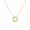 A delicate gold-tone chain finished with a refined round pendant. A timeless piece that can be worn on its own or layered with other necklaces.