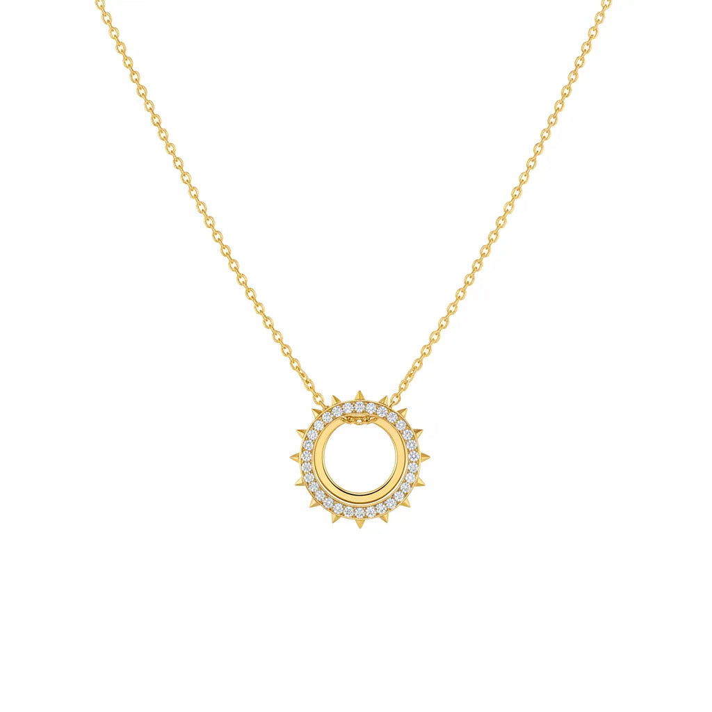 A delicate gold-tone chain finished with a refined round pendant. A timeless piece that can be worn on its own or layered with other necklaces.