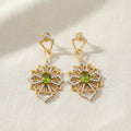 Beautiful earrings featuring intricate floral-inspired details. Their graceful design adds movement, sparkle, and feminine elegance to any occasion look.